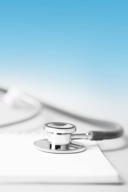 istock Medical concept - stethoscope with a spiral notebook 1213942237