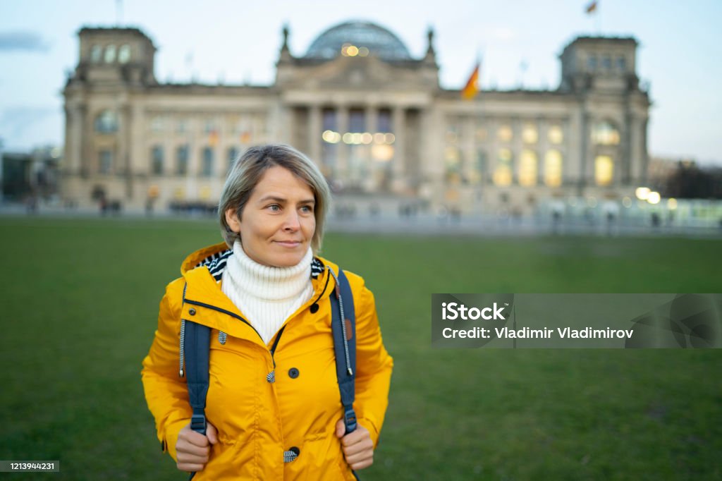Tourist woman in Berlin Tourist woman standing in front of Reichstag in Berlin Germany Stock Photo
