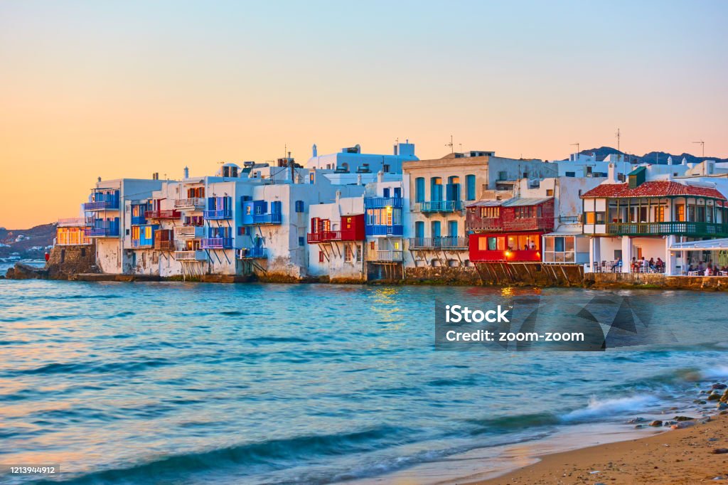 The Little Venice n Mykonos Island at sunset The Little Venice district with old colorful houses by the sea in Mykonos Island at sunset, Cyclades, Greece. Greek landscape Mykonos Stock Photo