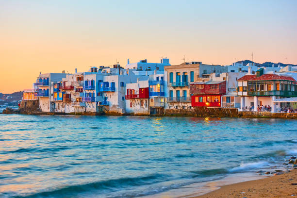 The Little Venice n Mykonos Island at sunset The Little Venice district with old colorful houses by the sea in Mykonos Island at sunset, Cyclades, Greece. Greek landscape mykonos photos stock pictures, royalty-free photos & images