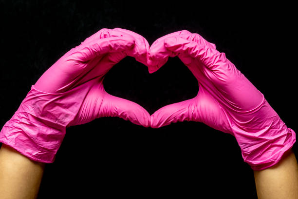 istock Heart shape with a female hand - Hands making heart -  Coronavirus - Covid 19 1213944923