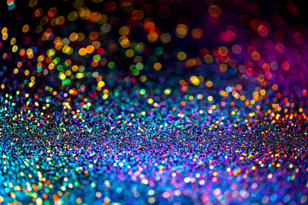 istock Shiny multicolor glitter raster background. Abstract shimmering pink, blue, yellow circles decorative backdrop. Bokeh lights effect illustration. Overlapping glowing and twinkling spots. 1213946182