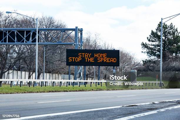 New York State Expressway Road Sign Stay Home Stop The Spread Covid19 Coronavirus Stock Photo - Download Image Now