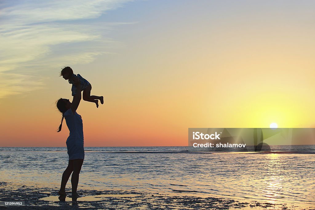 Family at sunset  Adult Stock Photo