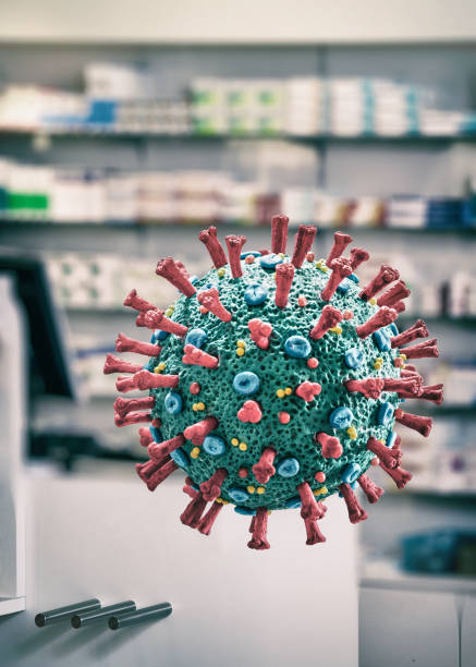 istock Corona Virus COVID-19 floating microscopic macro mockup in pharmacy 1213949733