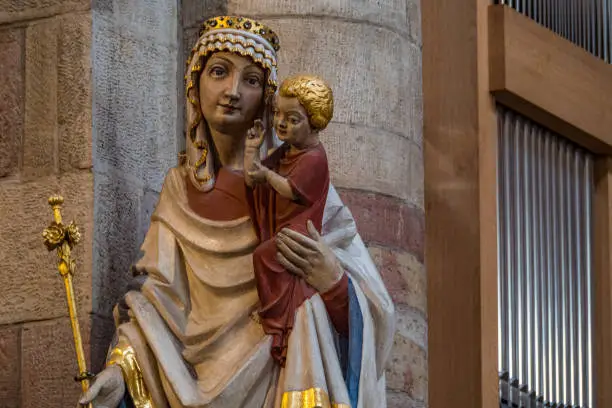 Statue of holy mary with baby jesus christ on the arm in the dome of Speyer