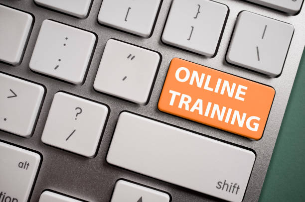 Modern Keyboard with orange Online Training key stock photo