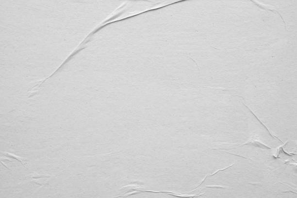 istock Blank white crumpled and creased paper poster texture background 1213960854