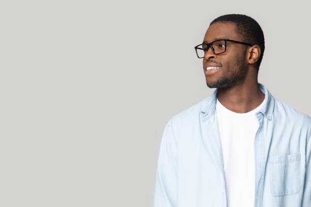 istock Smiling African American man in glasses looking at copy space 1213961282