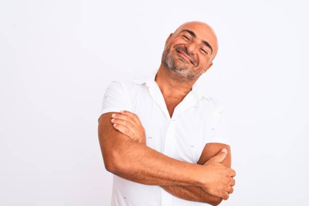 istock Middle age handsome man wearing elegant shirt standing over isolated white background happy face smiling with crossed arms looking at the camera. Positive person. 1213961365