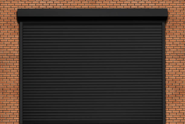 Closed black metal roller shutter door.