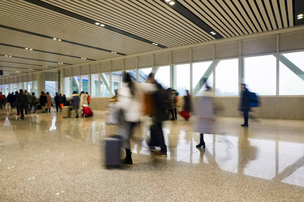 istock People walking in the corridor (motion blur) 1213979652