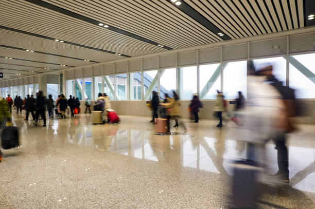 istock People walking in the corridor (motion blur) 1213979655