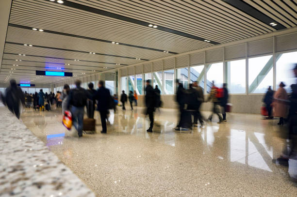 istock People walking in the corridor (motion blur) 1213979657