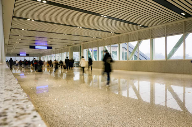 istock People walking in the corridor (motion blur) 1213979660