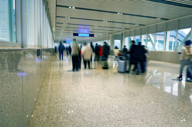 istock People walking in the corridor (motion blur) 1213979666