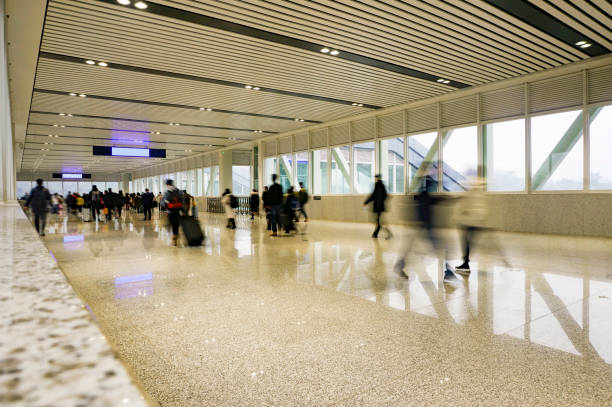 istock People walking in the corridor (motion blur) 1213979967