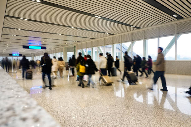 istock People walking in the corridor (motion blur) 1213980224