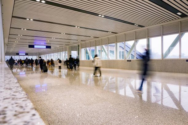 istock People walking in the corridor (motion blur) 1213980232