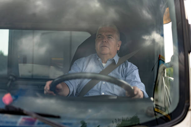 istock Mature man driving his truck looking focused 1213981130