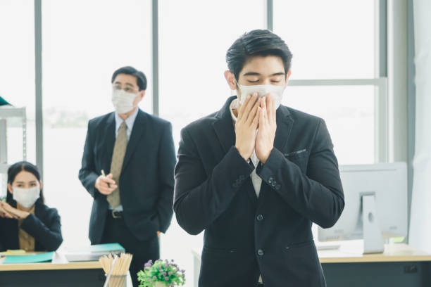 istock A business team wearing a working mask 1213981242
