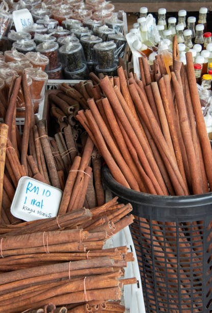 Huge cinnamon sticks at a stall in a typical market along the road to Mount Kinabalu in Sabah, Borneo, Malaysia.