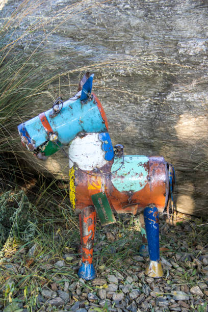 Tins cans and other rubbish put together as a statue of a horse, on display at an English-style garden in Cromwell.