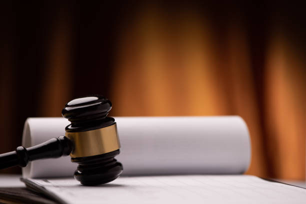 istock Judge`s gavel with white paper on the background. 1213991298