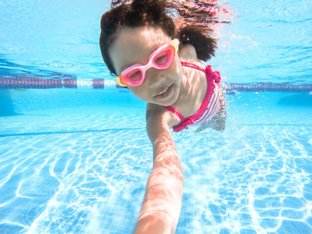 istock asian girl enjoy swimming 1213993337