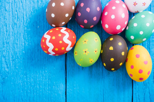 istock Easter eggs top view on blue wooden background 1213994961