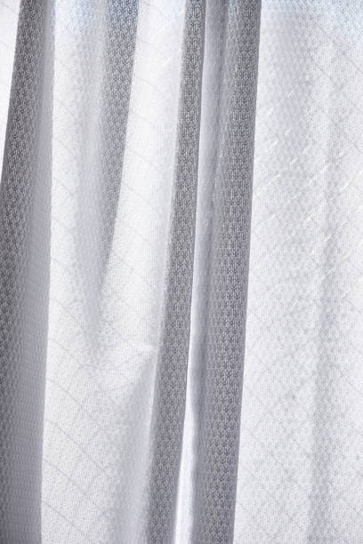 istock White lace curtain textured background 1213996740