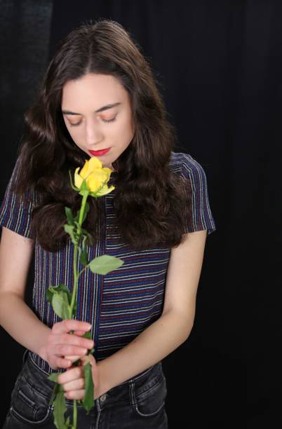 istock Woman And Yellow Flowers 1213996749