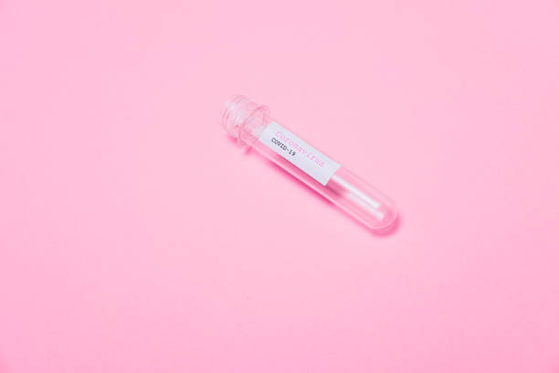 istock Minimal pop art style. COVID-19 test and open and empty laboratory sample for diagnosis new Coronavirus infection on pink background. Flat lay. 1214005067