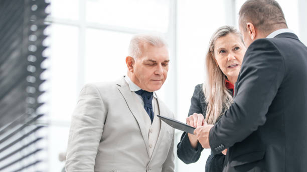 istock close up. business colleagues discussing business document. 1214010049