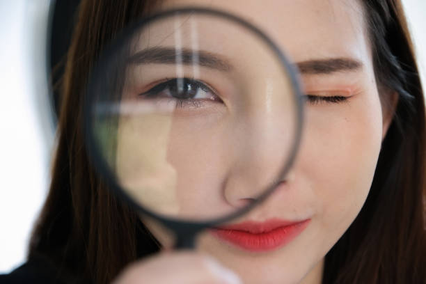 istock Business woman using magnifying to using audit or scan concept. 1214012781