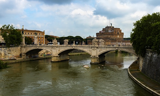 Rome, Italy, May 8, 2018:  Ponte Vittorio Emanuele II. over the Tiber River in the center of the city. In the background is the Castel Sant'Angelo.