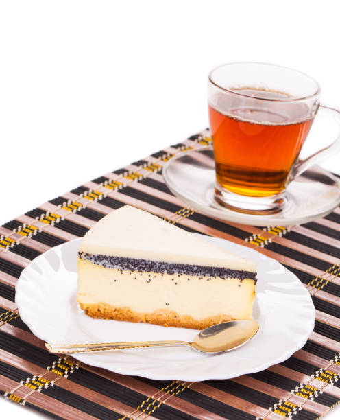 Still life with sliced cake and cup of tea.