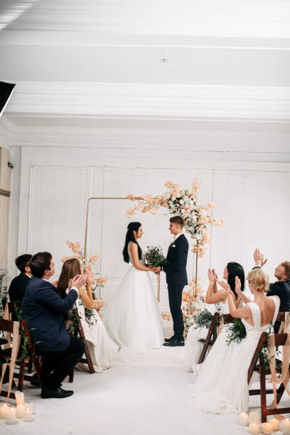 istock A couple of young newlyweds make vows 1214015683
