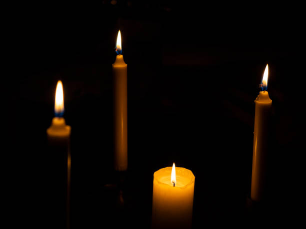 istock Burning candles with focus on the thickest candle 1214016018