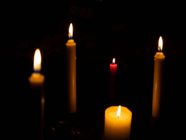 istock Burning candles with focus on the red candle 1214016580