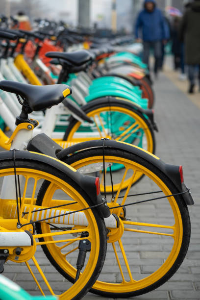 istock Rental bicycles are brightly for urban ride-sharing and Commuting, lined up on the sidewalks is in large cities. 1214016612