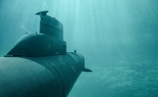Submarines under water A submarine dives in the sea through clear water. battleship photos stock pictures, royalty-free photos & images