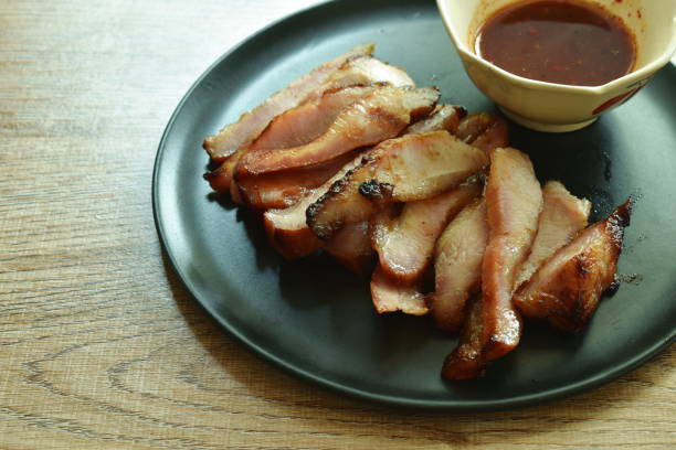 istock grilled slice pork neck dipping spicy sauce 1214019097