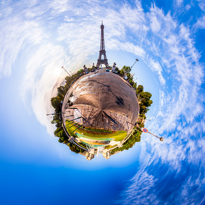 Miniature tiny planet of Scenic panorama of the Eiffel Tower seen from Pont d'Iena in Paris, France. 360 degree panoramic view