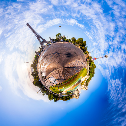 Miniature tiny planet of Scenic panorama of the Eiffel Tower seen from Pont d'Iena in Paris, France. 360 degree panoramic view