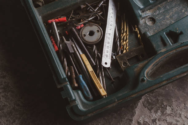 istock Old Box with drills, a ruler and screws. 1214021474
