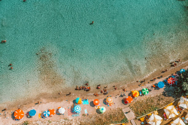 istock beach crowd from aerial look 1214023617