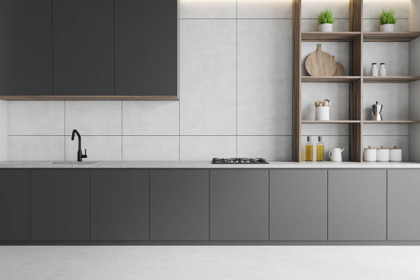istock White kitchen with gray countertops and shelves 1214024719