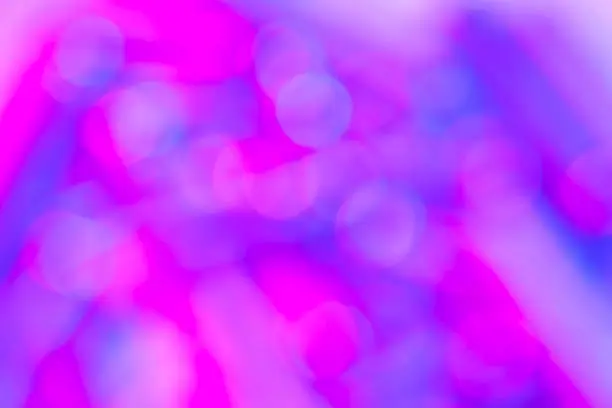 Photo of Bokeh with multi colors dots. Festive blue lights bokeh background. Defocused bokeh lights. Blurred bokeh. Light vintage background. Abstract colorful defocused pink dot. Soft focus