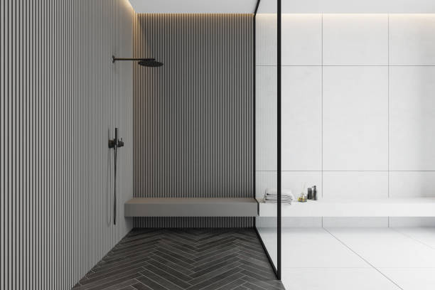istock Gray and white tile bathroom interior with shower 1214025283
